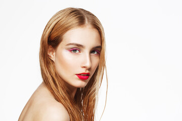 Naklejka premium Close-up portrait of young beautiful confident girl with bright make up. Looking in camera. White background. Isolated.