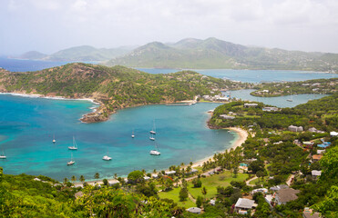 Naklejka na ściany i meble Antigua, Caribbean islands, English harbour view with Freeman’s bay and yachts anchored by the beach 