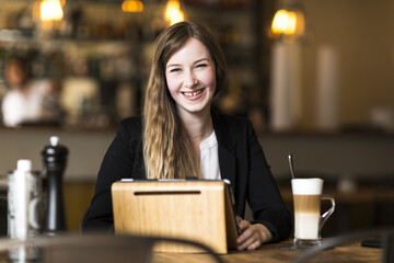 young business woman working at cafe at break