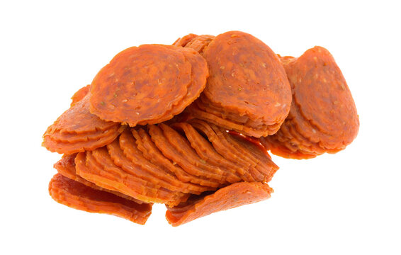 Pile Of Pepperoni Slices Isolated On A White Background.