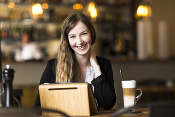 young business woman working at cafe at break