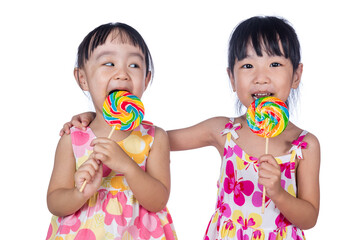 Asian Little Chinese girls eating lollipop