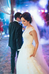 Naklejka premium The charming brides dancing on the dancefloor