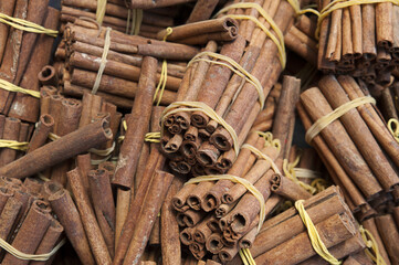 Background shot of raw cinnamon sticks at the local traditional market, also known as souk, Medina, Marrakesh, Morocco