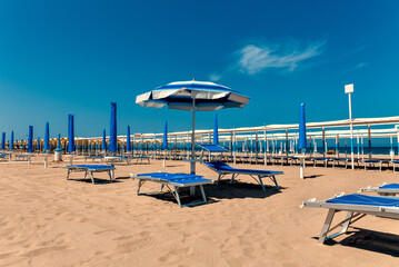 sand beach with umbrellas and chairs. Rimini, italy - 157392534