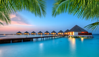 Water villas on Maldives resort island in sunset - obrazy, fototapety, plakaty