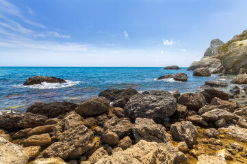 Fototapeta na wymiar the stones in the water king's beach / lower flight angle bright Sunny day