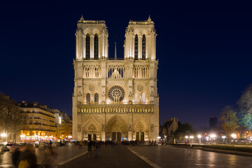 Notre Dame Cathedral with Paris cityscape at dusk