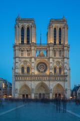 Fototapeta na wymiar Notre Dame Cathedral with Paris cityscape at dusk