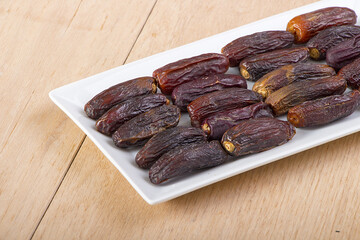 Dried dates in a white plate for iftar in Ramadan