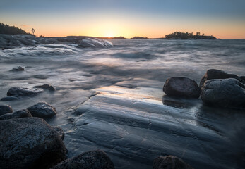 Seascape with windy weather and sunset at evening light in coastline, Finland