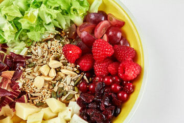 Fresh salade close up with fruit and cereals