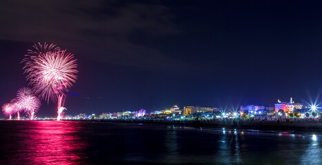 Night fireworks explosion on seafront. Rimini "Notte Rosa"