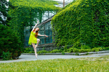 Dancing ballerina in the summer garden.