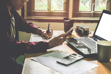 Man's work on my desk light sunset business concept Vintage tone.
