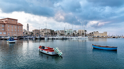 Fototapeta na wymiar cityscape of old town and seafront from marina after sunset. Cloudy sky