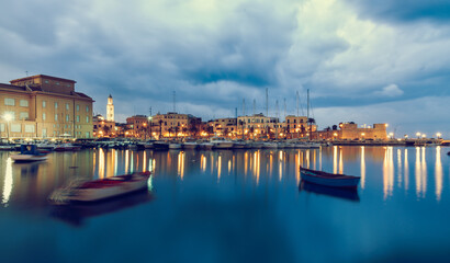 Bari seafront city view from marina. Blue sea and cloudy sky. Long exposure Filtered image