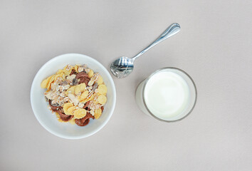 Top view Cornflakes cereal and milk in a bowl. Morning breakfast.