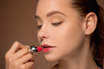 Beautiful female lips with make-up and brush