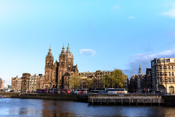 Fototapeta na wymiar Amsterdam channels, historical places of Amsterdam, beautiful houses along the river
