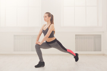 Fitness woman at stretching training indoors