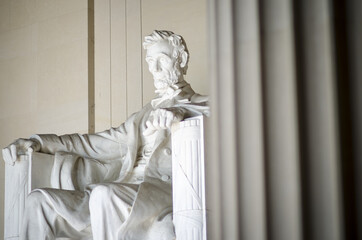Interior view of the Lincoln Memorial in Washington DC with an imposing fluted column in the foreground