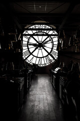 inside orsay museum and there is a big clock two people stand beside the clock - obrazy, fototapety, plakaty
