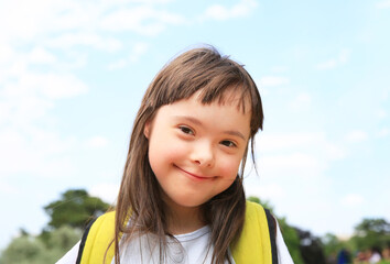 Portrait of little girl smiling outside