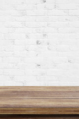 Empty wooden table over white brick wall  background, for product display montage
