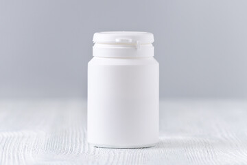 mock up plastic bottle for medicine, powder, pills, tabs, capsules, selective focus