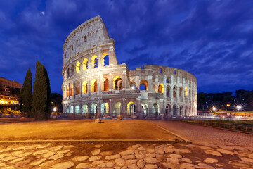Fototapeta na wymiar Colosseum or Coliseum at night, also known as the Flavian Amphitheatre, the largest amphitheatre ever built, in the centre of the old city of Rome, Italy.