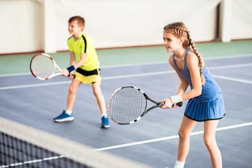 Foto op Canvas Happy children playing sport game on court © Yakobchuk Olena