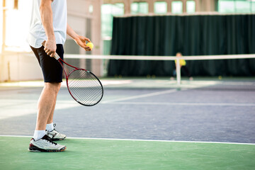 Skillful tennis player on playground