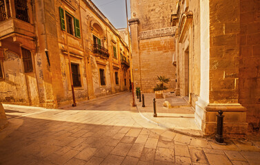  This is Casa Inguanez, a large limestone building with these green shutters.It was originally built in the mid-14th century as the residence for the noble Inguanez family in Mdina ,Malta.