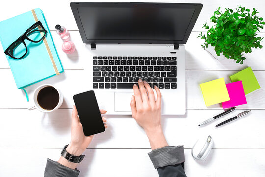 Overhead view of businesswoman working at computer in office