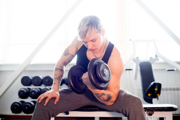 Naklejka na ściany i meble Man workout at gym