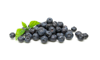 Ripe blueberries and green leaves close-up on a white background