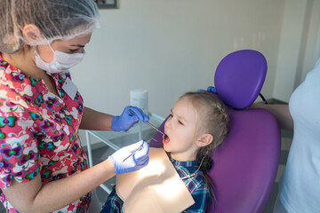 Child as patient with female dentist