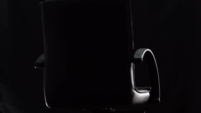 Office chair rotate in the darkness, Multi shot
