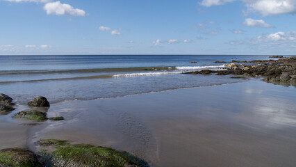 Fototapeta na wymiar Calm sunny beach day in South Cornwall, UK