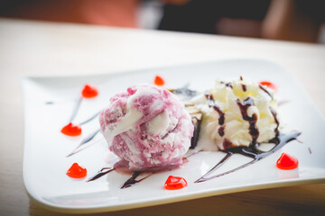 Homemade brownies with vanilla ice cream and whipped cream.(selective focus)