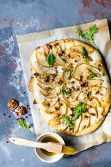 Homemade pizza with pear and gorgonzola on a gray table - 157417125