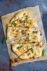Homemade pizza with pear and gorgonzola on a gray table - 157417163