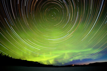 Star trails and Northern lights in night sky