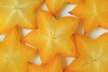 Close-up of vibrant color sliced ripe Star Fruit, for background and texture 