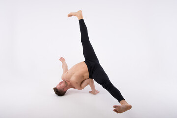 Break dance and sexy guy without a shirt. Studio. White background.