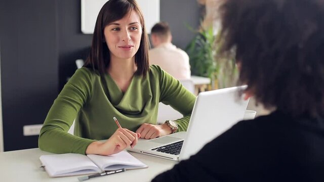 Young woman is talking to her female client
