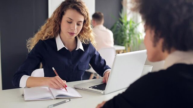 Young woman is talking to her female client