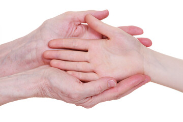Fototapeta premium Old and young holding hands, isolated on a white background.