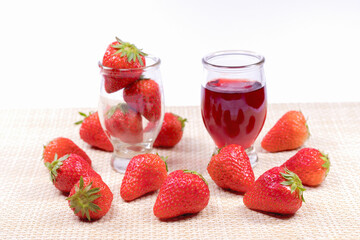 Fresh strawberries and strawberry jam in the glass jar